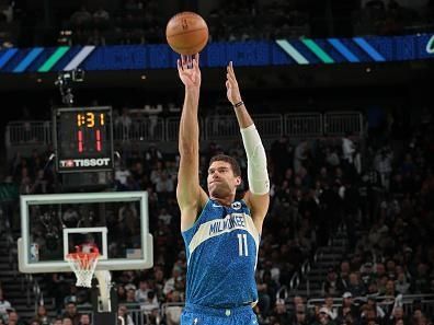 MILWAUKEE, WI - NOVEMBER 24: Brook Lopez #11 of the Milwaukee Bucks shoots a three point basket against the Washington Wizards during the In-Season Tournament on November 24, 2023 at the Fiserv Forum Center in Milwaukee, Wisconsin. NOTE TO USER: User expressly acknowledges and agrees that, by downloading and or using this Photograph, user is consenting to the terms and conditions of the Getty Images License Agreement. Mandatory Copyright Notice: Copyright 2023 NBAE (Photo by Gary Dineen/NBAE via Getty Images).