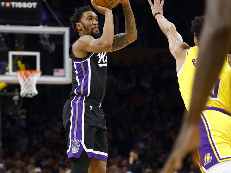 LOS ANGELES, CALIFORNIA - MARCH 06:  Malik Monk #0 of the Sacramento Kings takes a shot against the Los Angeles Lakers in the first half at Crypto.com Arena on March 06, 2024 in Los Angeles, California.  NOTE TO USER: User expressly acknowledges and agrees that, by downloading and/or using this photograph, user is consenting to the terms and conditions of the Getty Images License Agreement.  (Photo by Ronald Martinez/Getty Images)