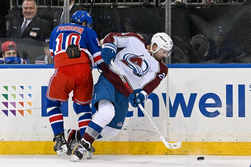 Feb 5, 2024; New York, New York, USA;  New York Rangers left wing Artemi Panarin (10) checks Colorado Avalanche center Nathan MacKinnon (29) during the third period at Madison Square Garden. Mandatory Credit: Dennis Schneidler-USA TODAY Sports