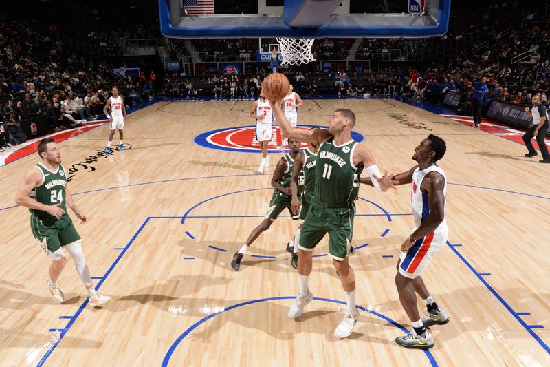 DETROIT, MI - OCTOBER 6: Brook Lopez #11 of the Milwaukee Bucks rebounds the ball during the game against the Detroit Pistons during a NBA preseason game on October 6, 2024 at Little Caesars Arena in Detroit, Michigan. NOTE TO USER: User expressly acknowledges and agrees that, by downloading and/or using this photograph, User is consenting to the terms and conditions of the Getty Images License Agreement. Mandatory Copyright Notice: Copyright 2024 NBAE (Photo by Chris Schwegler/NBAE via Getty Images)