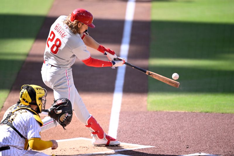 Sep 4, 2023; San Diego, California, USA; Philadelphia Phillies first baseman Alec Bohm (28) hits a three-RBI double against the San Diego Padres during the first inning at Petco Park. Mandatory Credit: Orlando Ramirez-USA TODAY Sports