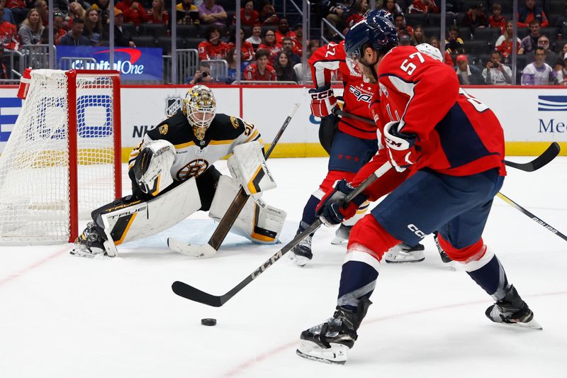 Oct 5, 2024; Washington, District of Columbia, USA; Washington Capitals defenseman Trevor van Riemsdyk (57) scores a goal on Boston Bruins goaltender Brandon Bussi (30) in the third period at Capital One Arena. Mandatory Credit: Geoff Burke-Imagn Images