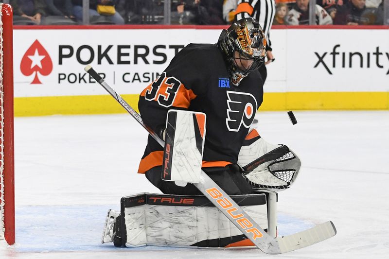 Feb 25, 2025; Philadelphia, Pennsylvania, USA; Philadelphia Flyers goaltender Samuel Ersson (33) makes a save against the Pittsburgh Penguins during the first period at Wells Fargo Center. Mandatory Credit: Eric Hartline-Imagn Images