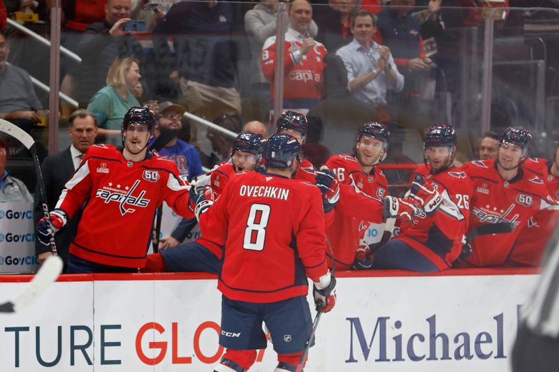 Oct 29, 2024; Washington, District of Columbia, USA; Washington Capitals left wing Alex Ovechkin (8) celebrates with teammates after scoring a goal against the New York Rangers in the first period at Capital One Arena. Mandatory Credit: Geoff Burke-Imagn Images