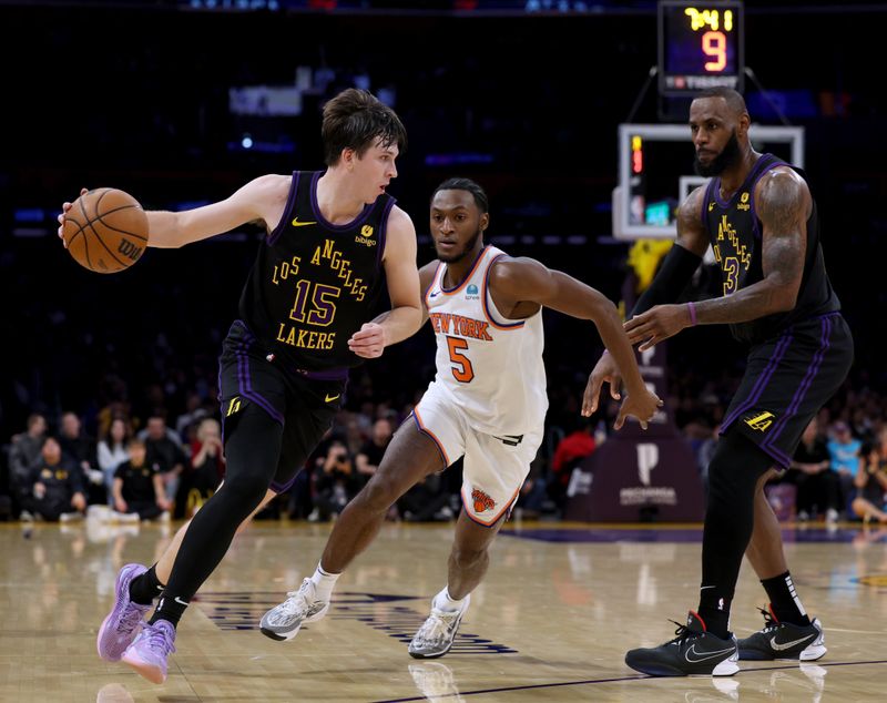 LOS ANGELES, CALIFORNIA - DECEMBER 18: Austin Reaves #15 of the Los Angeles Lakers dribbles off a screen on Immanuel Quickley #5 of the New York Knicks set by LeBron James #23 during a 114-109 Knicks win at Crypto.com Arena on December 18, 2023 in Los Angeles, California. NOTE TO USER: User expressly acknowledges and agrees that, by downloading and or using this photograph, User is consenting to the terms and conditions of the Getty Images License Agreement. (Photo by Harry How/Getty Images)