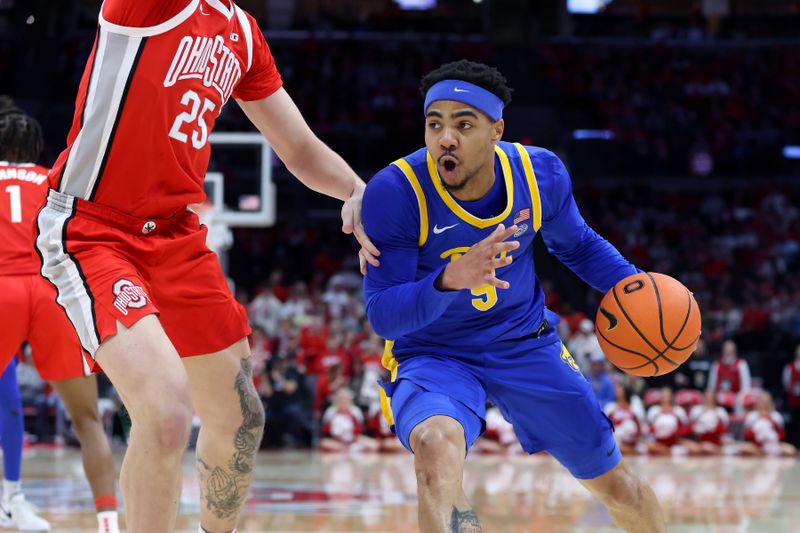 Nov 29, 2024; Columbus, Ohio, USA; Pittsburgh Panthers guard Ishmael Leggett (5) drives to the rim as Ohio State Buckeyes center Austin Parks (25) defends during the first half at Value City Arena. Mandatory Credit: Joseph Maiorana-Imagn Images