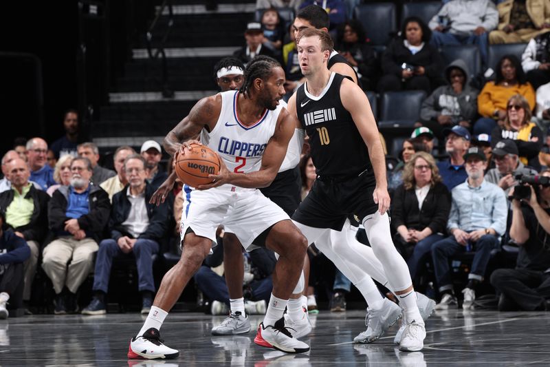 MEMPHIS, TN - FEBRUARY 23: Kawhi Leonard #2 of the LA Clippers looks to pass the ball during the game against the Memphis Grizzlies on February 23, 2024 at FedExForum in Memphis, Tennessee. NOTE TO USER: User expressly acknowledges and agrees that, by downloading and or using this photograph, User is consenting to the terms and conditions of the Getty Images License Agreement. Mandatory Copyright Notice: Copyright 2024 NBAE (Photo by Joe Murphy/NBAE via Getty Images)