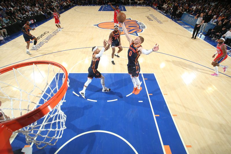 NEW YORK, NY - APRIL 22:  Donte Divincenzo #0 of the New York Knicks grabs the rebound during the game against the Philadelphia 76ers during Round 1 Game 2 of the 2024 NBA Playoffs on April 22, 2024 at Madison Square Garden in New York City, New York.  NOTE TO USER: User expressly acknowledges and agrees that, by downloading and or using this photograph, User is consenting to the terms and conditions of the Getty Images License Agreement. Mandatory Copyright Notice: Copyright 2024 NBAE  (Photo by Nathaniel S. Butler/NBAE via Getty Images)