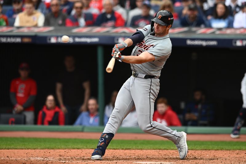 Oct 12, 2024; Cleveland, Ohio, USA; Detroit Tigers second base Colt Keith (33) hits a double in the seventh inning against the Cleveland Guardians during game five of the ALDS for the 2024 MLB Playoffs at Progressive Field. Mandatory Credit: Ken Blaze-Imagn Images