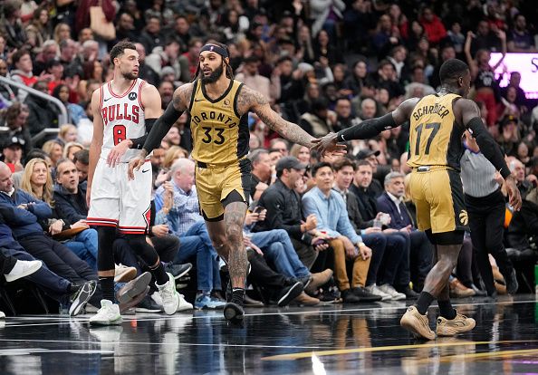 TORONTO, ON - NOVEMBER 24: Gary Trent Jr. #33 of the Toronto Raptors celebrates with Dennis Schroder #17 besides Zach LaVine #8 of the Chicago Bulls during the second half of the NBA In-Season Tournament game at the Scotiabank Arena on November 24, 2023 in Toronto, Ontario, Canada. NOTE TO USER: User expressly acknowledges and agrees that, by downloading and/or using this Photograph, user is consenting to the terms and conditions of the Getty Images License Agreement. (Photo by Mark Blinch/Getty Images)