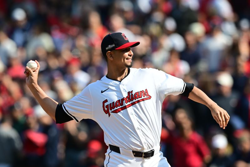 Oct 12, 2024; Cleveland, Ohio, USA; Cleveland Guardians Carlos Carrasco throws out the ceremonial first pitch before the game against the Detroit Tigers during game five of the ALDS for the 2024 MLB Playoffs at Progressive Field. Mandatory Credit: Ken Blaze-Imagn Images