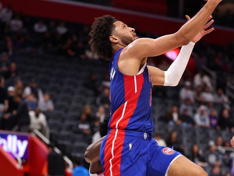 DETROIT, MICHIGAN - NOVEMBER 01: Cade Cunningham #2 of the Detroit Pistons drives to the basket against OG Anunoby #8 of the New York Knicks during the first half at Little Caesars Arena on November 01, 2024 in Detroit, Michigan. NOTE TO USER: User expressly acknowledges and agrees that, by downloading and or using this photograph, User is consenting to the terms and conditions of the Getty Images License. (Photo by Gregory Shamus/Getty Images)