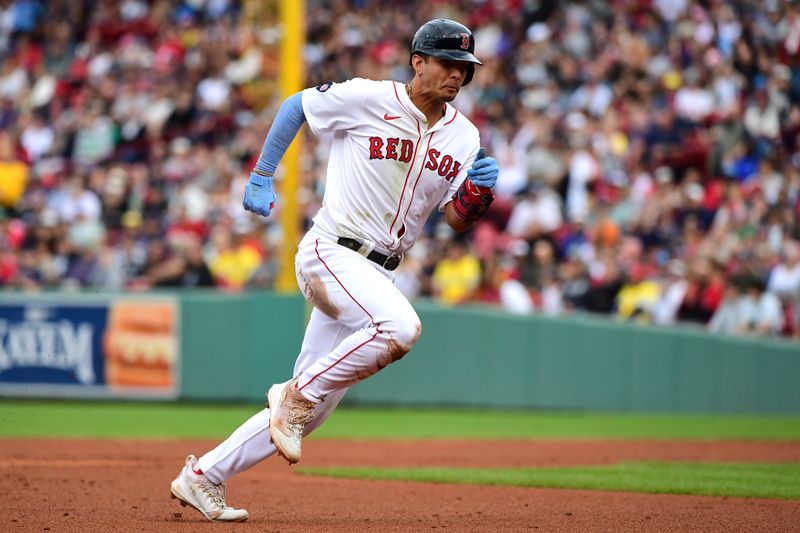 Sep 29, 2024; Boston, Massachusetts, USA;  Boston Red Sox second baseman Vaughn Grissom (5) runs to third base during the fifth inning against the Tampa Bay Rays at Fenway Park. Mandatory Credit: Bob DeChiara-Imagn Images