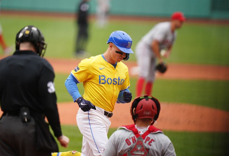 Apr 14, 2024; Boston, Massachusetts, USA; Boston Red Sox right fielder Tyler O'Neill (17) taggs home plate after hitting a home run against the Los Angeles Angels in the first inning at Fenway Park. Mandatory Credit: David Butler II-USA TODAY Sports