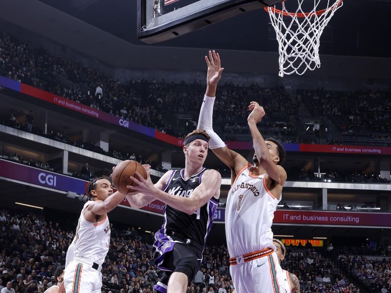 SACRAMENTO, CA - FEBRUARY 22: Kevin Huerter #9 of the Sacramento Kings passes the ball during the game against the San Antonio Spurs on February 22, 2024 at Golden 1 Center in Sacramento, California. NOTE TO USER: User expressly acknowledges and agrees that, by downloading and or using this Photograph, user is consenting to the terms and conditions of the Getty Images License Agreement. Mandatory Copyright Notice: Copyright 2023 NBAE (Photo by Rocky Widner/NBAE via Getty Images)