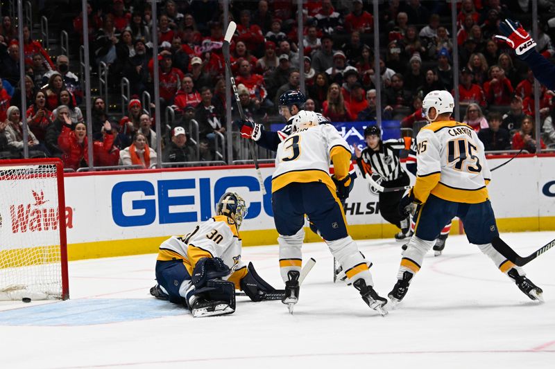 Dec 30, 2023; Washington, District of Columbia, USA; Washington Capitals left wing Beck Malenstyn (47) scores a goal past Nashville Predators goaltender Yaroslav Askarov (30) during the first period at Capital One Arena. Mandatory Credit: Brad Mills-USA TODAY Sports