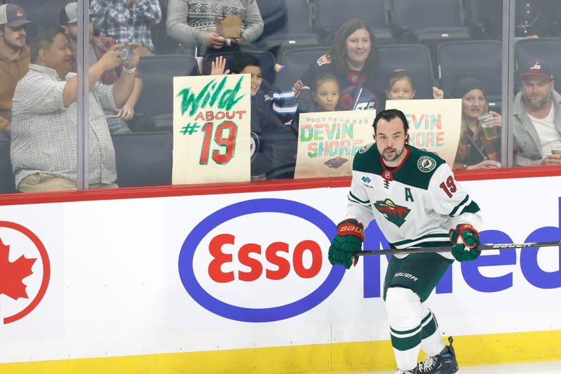 Sep 21, 2024; Winnipeg, Manitoba, CAN; Minnesota Wild Devin Shore (19) warms up before a preseason game against the Winnipeg Jets at Canada Life Centre. Mandatory Credit: James Carey Lauder-Imagn Images