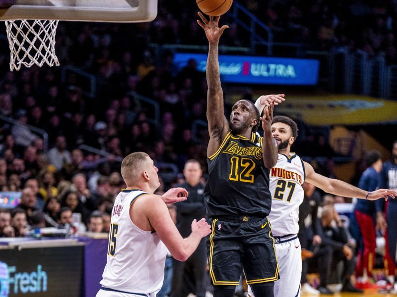 LOS ANGELES, CA - FEBRUARY 8: Taurean Prince #12 of the Los Angeles Lakers drives to the basket during the game against the Denver Nuggets on February 8, 2024 NBAE at Crypto.Com Arena in Los Angeles, California. NOTE TO USER: User expressly acknowledges and agrees that, by downloading and/or using this Photograph, user is consenting to the terms and conditions of the Getty Images License Agreement. Mandatory Copyright Notice: Copyright 2024 NBAE (Photo by Tyler Ross/NBAE via Getty Images)