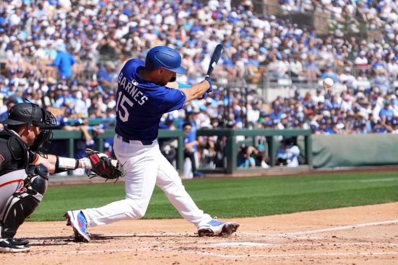 Mar 1, 2025; Phoenix, Arizona, USA; Los Angeles Dodgers catcher Austin Barnes (15) bats against the San Francisco Giants during the second inning at Camelback Ranch-Glendale. Mandatory Credit: Joe Camporeale-Imagn Images