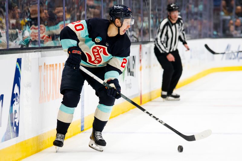 Feb 24, 2024; Seattle, Washington, USA; Seattle Kraken right wing Eeli Tolvanen (20) looks to pass the puck against the Minnesota Wild during the first period at Climate Pledge Arena. Mandatory Credit: Joe Nicholson-USA TODAY Sports