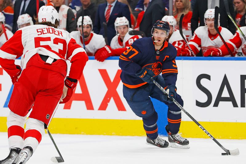 Feb 15, 2023; Edmonton, Alberta, CAN; Edmonton Oilers forward Connor McDavid (97) looks to make a pass in front of Detroit Red Wings defensemen Moritz Seider (53) during the first period at Rogers Place. Mandatory Credit: Perry Nelson-USA TODAY Sports