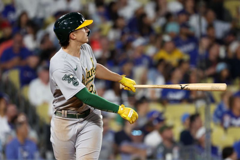 Aug 3, 2023; Los Angeles, California, USA;  Oakland Athletics second baseman Zack Gelof (20) hits a home run during the sixth inning against the Los Angeles Dodgers at Dodger Stadium. Mandatory Credit: Kiyoshi Mio-USA TODAY Sports