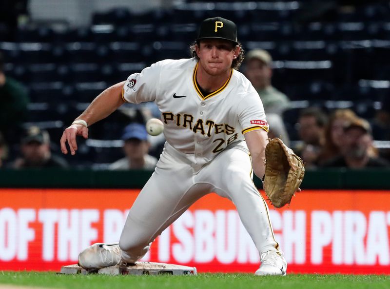 Sep 24, 2024; Pittsburgh, Pennsylvania, USA;  Pittsburgh Pirates first baseman Billy Cook (28) takes a throw at first base to retire Milwaukee Brewers catcher William Contreras (not pictured) during the third inning at PNC Park. Mandatory Credit: Charles LeClaire-Imagn Images