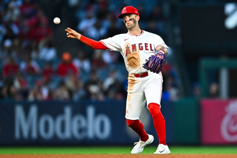 May 3, 2025; Anaheim, California, USA; Los Angeles Angels shortstop Zach Neto (9) throws to first base against the Detroit Tigers during the fourth inning at Angel Stadium. Mandatory Credit: Jonathan Hui-Imagn Images