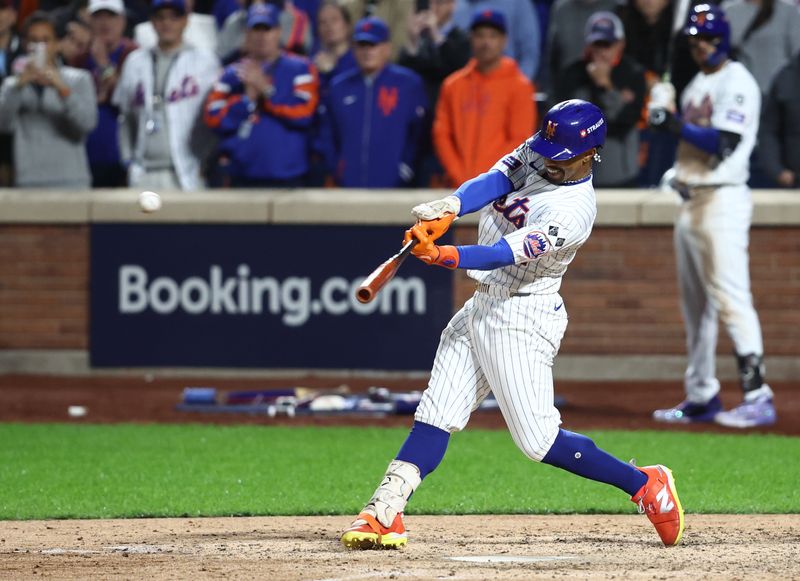 Oct 9, 2024; New York, New York, USA;  New York Mets shortstop Francisco Lindor (12) hits a grand slam against the Philadelphia Phillies in the sixth inning in game four of the NLDS for the 2024 MLB Playoffs at Citi Field. Mandatory Credit: Wendell Cruz-Imagn Images