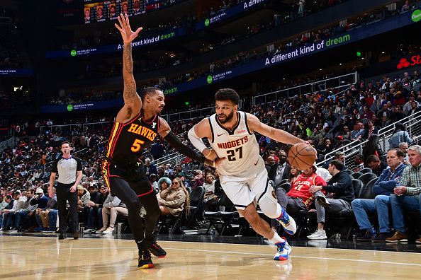 ATLANTA, GA - DECEMBER 11: Jamal Murray #27 of the Denver Nuggets drives to the basket during the game against the Atlanta Hawks on December 11, 2023 at State Farm Arena in Atlanta, Georgia.  NOTE TO USER: User expressly acknowledges and agrees that, by downloading and/or using this Photograph, user is consenting to the terms and conditions of the Getty Images License Agreement. Mandatory Copyright Notice: Copyright 2023 NBAE (Photo by Scott Cunningham/NBAE via Getty Images)