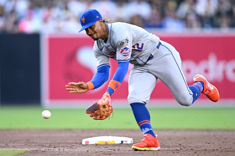 Aug 24, 2024; San Diego, California, USA; New York Mets shortstop Francisco Lindor (12) fields a ground ball hit by San Diego Padres first baseman Luis Arraez (not pictured) during the third inning at Petco Park. Mandatory Credit: Orlando Ramirez-USA TODAY Sports