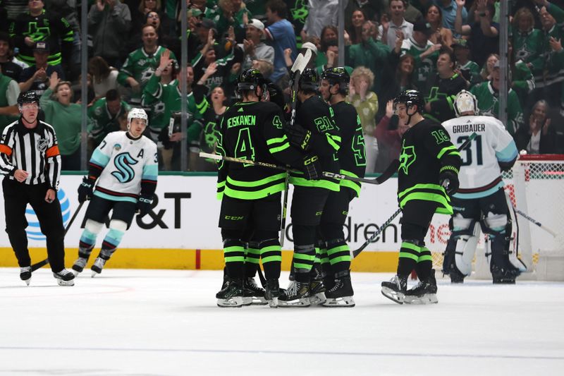 Apr 13, 2024; Dallas, Texas, USA; Dallas Stars players celebrate a goal against the Seattle Kraken in the first period at American Airlines Center. Mandatory Credit: Tim Heitman-USA TODAY Sports