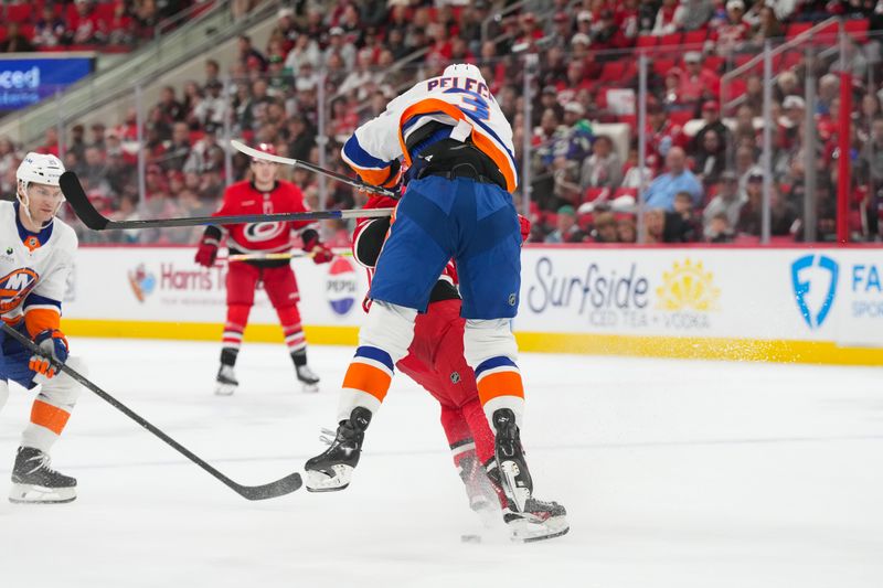 Oct 30, 2025; Raleigh, North Carolina, USA; New York Islanders defenseman Adam Pelech (3) checks Carolina Hurricanes right wing Jackson Blake (53) during the third period at Lenovo Center. Mandatory Credit: James Guillory-Imagn Images Oct 30, 2025; Raleigh, North Carolina, USA; New York Islanders defenseman Adam Pelech (3) checks Carolina Hurricanes right wing Jackson Blake (53) during the third period at Lenovo Center. Mandatory Credit: James Guillory-Imagn Images