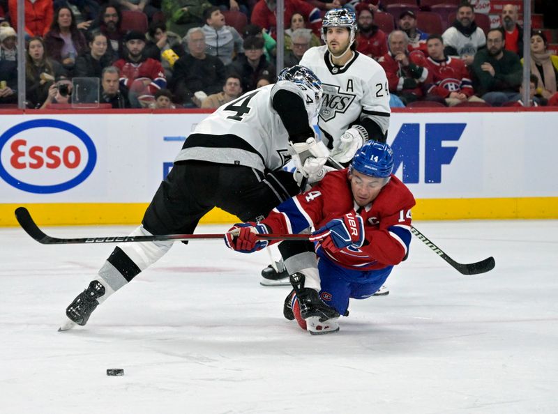 Dec 7, 2023; Montreal, Quebec, CAN; Los Angeles Kings defenseman Vladislav Gavrikov (84) trips Montreal Canadiens forward Nick Suzuki (14) during the second period at the Bell Centre. Mandatory Credit: Eric Bolte-USA TODAY Sports