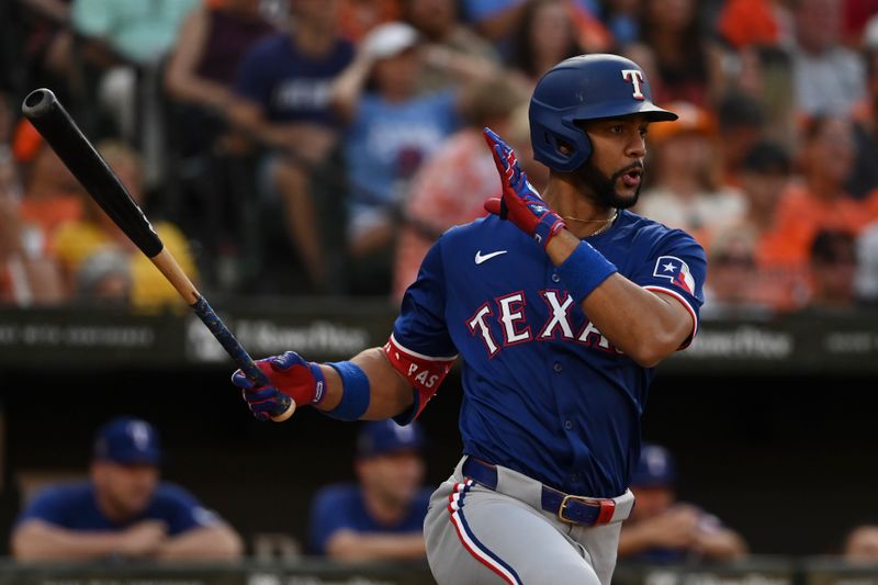 Jun 28, 2024; Baltimore, Maryland, USA; Texas Rangers second baseman Marcus Semien (2) swings through  a third inning single against the Baltimore Oriolesm  at Oriole Park at Camden Yards. Mandatory Credit: Tommy Gilligan-USA TODAY Sports