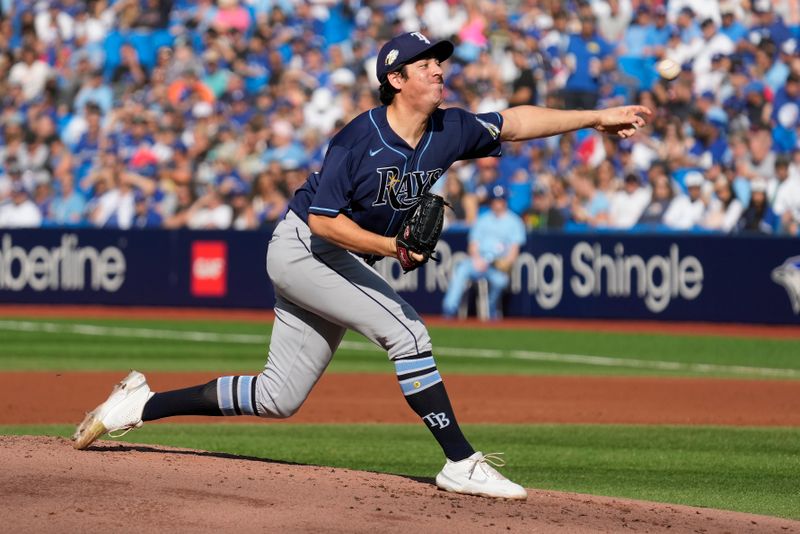 Oct 1, 2023; Toronto, Ontario, CAN; Tampa Bay Rays starting pitcher Jacob Lopez (74) pitches to to the Toronto Blue Jays during the second inning at Rogers Centre. Mandatory Credit: John E. Sokolowski-USA TODAY Sports