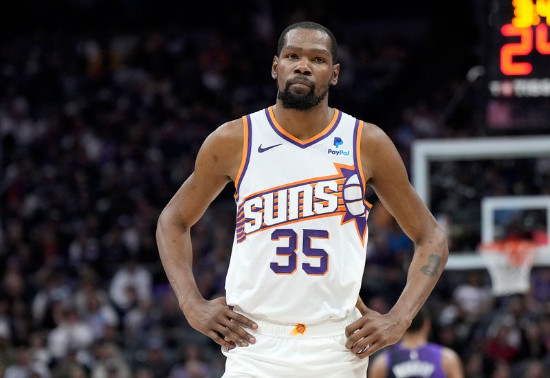 SACRAMENTO, CALIFORNIA - APRIL 12: Kevin Durant #35 of the Phoenix Suns looks on against the Sacramento Kings during the first half of an NBA basketball game at Golden 1 Center on April 12, 2024 in Sacramento, California. NOTE TO USER: User expressly acknowledges and agrees that, by downloading and or using this photograph, User is consenting to the terms and conditions of the Getty Images License Agreement. (Photo by Thearon W. Henderson/Getty Images)