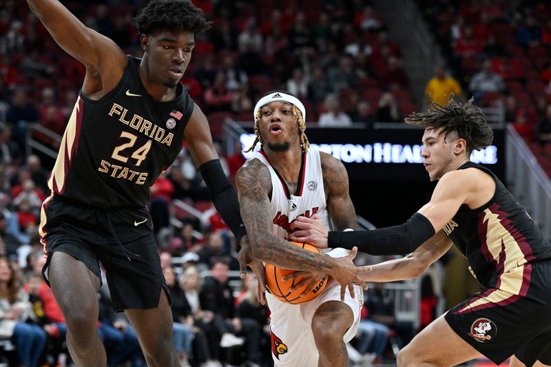 Feb 4, 2023; Louisville, Kentucky, USA;  Louisville Cardinals guard El Ellis (3) drives to the basket against Florida State Seminoles center Naheem McLeod (24) and guard Jalen Warley (1) during the second half at KFC Yum! Center. Florida State defeated Louisville 81-78. Mandatory Credit: Jamie Rhodes-USA TODAY Sports