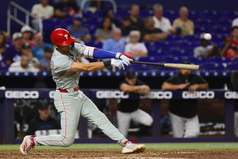 Sep 6, 2024; Miami, Florida, USA; Philadelphia Phillies shortstop Trea Turner (7) hits an RBI double against the Miami Marlins during the fifth inning at loanDepot Park. Mandatory Credit: Sam Navarro-Imagn Images