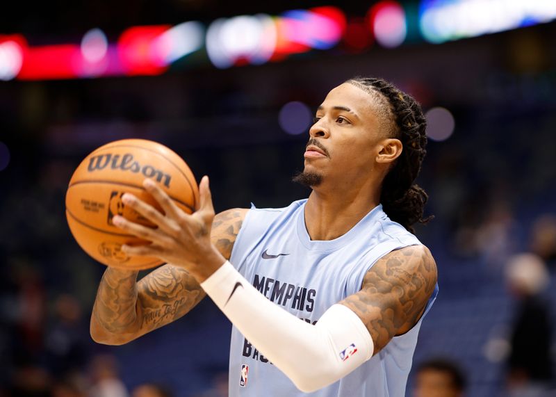 NEW ORLEANS, LOUISIANA - DECEMBER 19: Ja Morant #12 of the Memphis Grizzlies warms up prior to playing the New Orleans Pelicans at Smoothie King Center on December 19, 2023 in New Orleans, Louisiana.  NOTE TO USER: User expressly acknowledges and agrees that, by downloading and or using this photograph, User is consenting to the terms and conditions of the Getty Images License Agreement. (Photo by Chris Graythen/Getty Images)