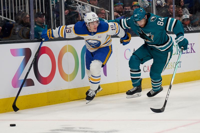 Jan 27, 2024; San Jose, California, USA; Buffalo Sabres center Peyton Krebs (19) battles for the puck against San Jose Sharks defenseman Jan Rutta (84) during the first period at SAP Center at San Jose. Mandatory Credit: Robert Edwards-USA TODAY Sports