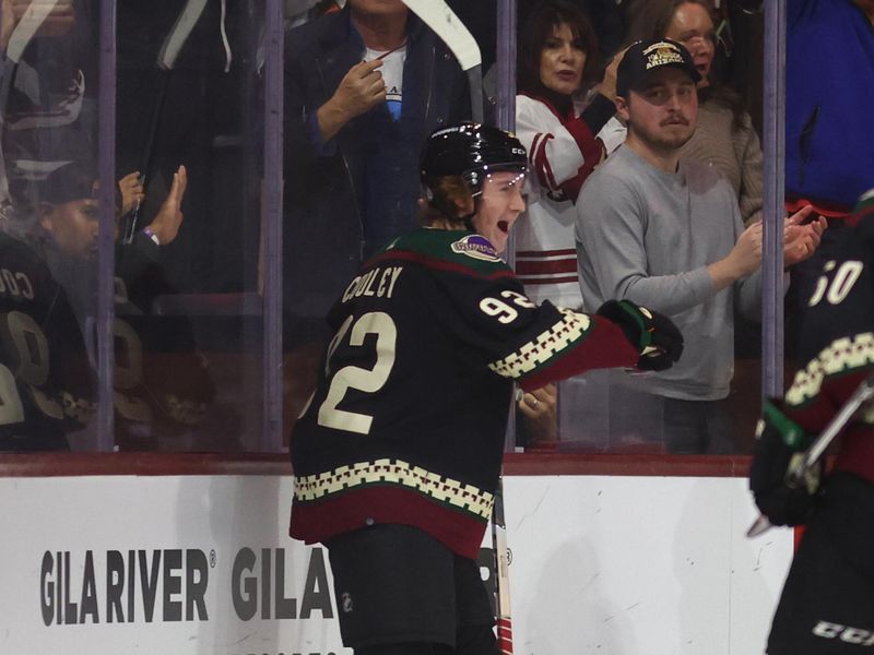 Dec 4, 2023; Tempe, Arizona, USA; Arizona Coyotes center Logan Cooley (92) celebrates after scoring a goal against the Washington Capitals in the first period at Mullett Arena. Mandatory Credit: Mark J. Rebilas-USA TODAY Sports