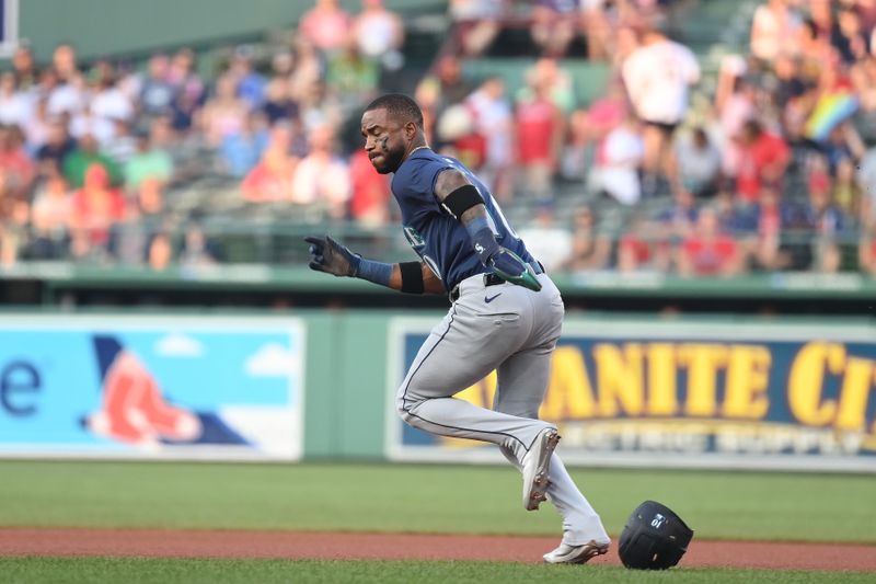 Jul 30, 2024; Boston, Massachusetts, USA; Seattle Mariners center fielder Victor Robles (10) steals second base during the first inning against the Boston Red Sox at Fenway Park. Mandatory Credit: Eric Canha-USA TODAY Sports