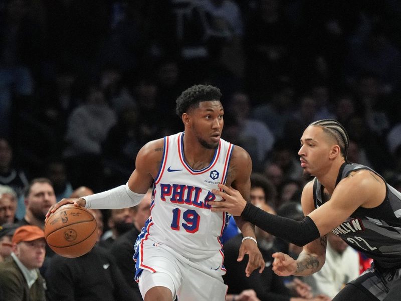 BROOKLYN, NY - FEBRUARY 12: Justin Edwards #19 of the Philadelphia 76ers dribbles the ball during the game against the Brooklyn Nets on February 12, 2025 at Barclays Center in Brooklyn, New York. NOTE TO USER: User expressly acknowledges and agrees that, by downloading and or using this Photograph, user is consenting to the terms and conditions of the Getty Images License Agreement. Mandatory Copyright Notice: Copyright 2025 NBAE (Photo by Jesse D. Garrabrant/NBAE via Getty Images)