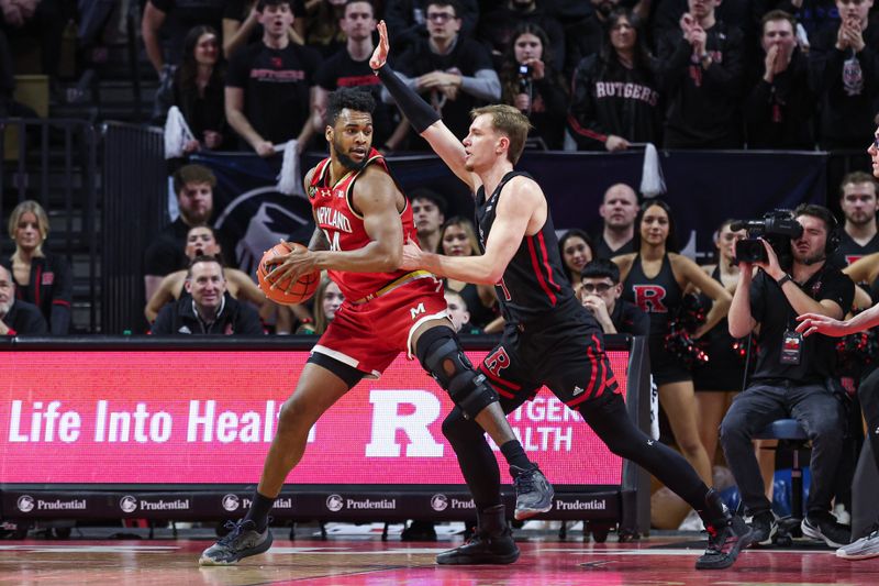 Feb 25, 2024; Piscataway, New Jersey, USA; Maryland Terrapins forward Donta Scott (24) is guarded by Rutgers Scarlet Knights forward Oskar Palmquist (9) during the second half at Jersey Mike's Arena. Mandatory Credit: Vincent Carchietta-USA TODAY Sports