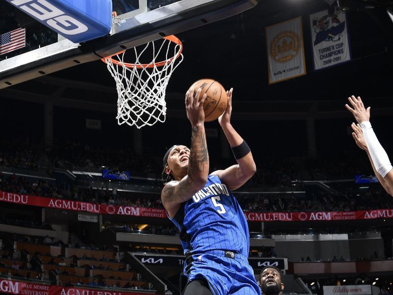 ORLANDO, FL - APRIL 1: Paolo Banchero #5 of the Orlando Magic drives to the basket during the game against the Portland Trail Blazers on April 1, 2024 at Kia Center in Orlando, Florida. NOTE TO USER: User expressly acknowledges and agrees that, by downloading and or using this photograph, User is consenting to the terms and conditions of the Getty Images License Agreement. Mandatory Copyright Notice: Copyright 2024 NBAE (Photo by Fernando Medina/NBAE via Getty Images)