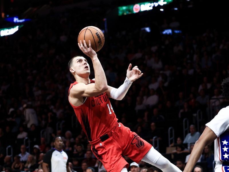 MIAMI, FLORIDA - NOVEMBER 18: Tyler Herro #14 of the Miami Heat puts up a fadeaway shot against the Philadelphia 76ers during the second half at Kaseya Center on November 18, 2024 in Miami, Florida. NOTE TO USER: User expressly acknowledges and agrees that, by downloading and or using this Photograph, user is consenting to the terms and conditions of the Getty Images License Agreement.  (Photo by Carmen Mandato/Getty Images)