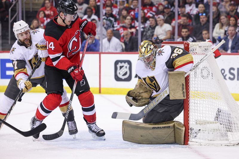 Jan 22, 2024; Newark, New Jersey, USA; Vegas Golden Knights goaltender Logan Thompson (36) makes a save in front of New Jersey Devils right wing Nathan Bastian (14) and defenseman Alex Pietrangelo (7) during the first period at Prudential Center. Mandatory Credit: Vincent Carchietta-USA TODAY Sports