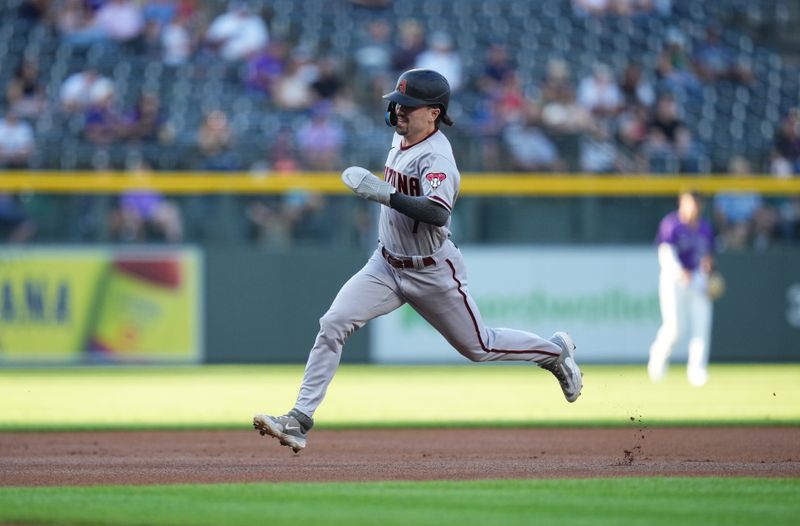 Aug 14, 2023; Denver, Colorado, USA; Arizona Diamondbacks right fielder Corbin Carroll (7) heads to third on his way to score a run in the first inning against the Colorado Rockies at Coors Field. Mandatory Credit: Ron Chenoy-USA TODAY Sports