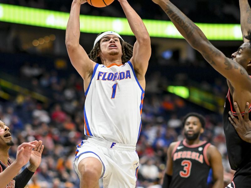 Mar 14, 2024; Nashville, TN, USA;  Florida Gators guard Walter Clayton Jr. (1) shoots against the Georgia Bulldogs during the second half at Bridgestone Arena. Mandatory Credit: Steve Roberts-USA TODAY Sports